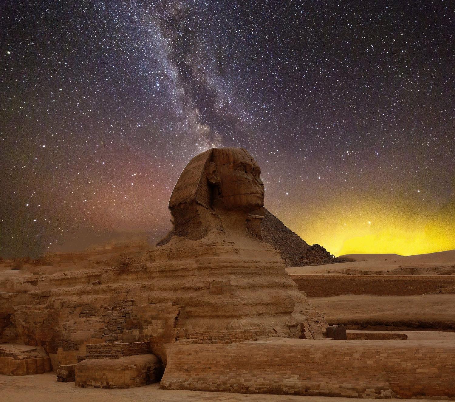 La Gran Esfinge de Giza bajo un cielo estrellado con la Vía Láctea, simbolizando la unión entre la sabiduría antigua y el misterio del cosmos. La Gran Esfinge de Giza bajo un cielo estrellado con la Vía Láctea, simbolizando la unión entre la sabiduría antigua y el misterio del cosmos.